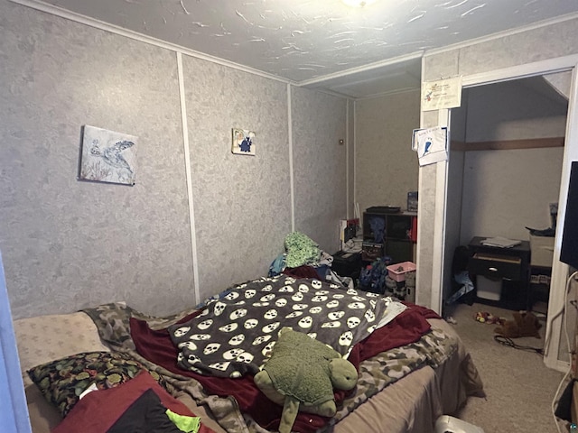 carpeted bedroom featuring crown molding