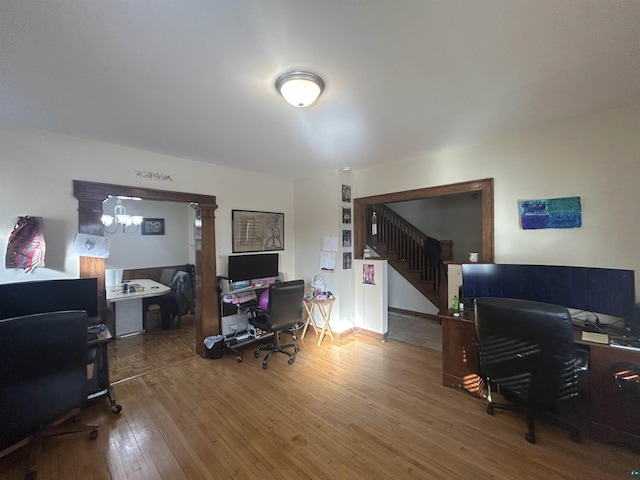 home office featuring hardwood / wood-style floors and ornate columns