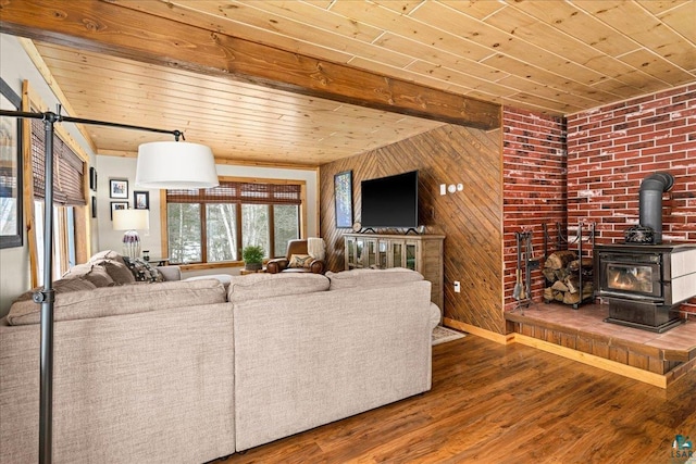 living room with wood-type flooring, a wood stove, and wood ceiling