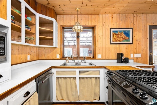 kitchen with sink, stainless steel dishwasher, range with gas stovetop, hanging light fixtures, and wood ceiling