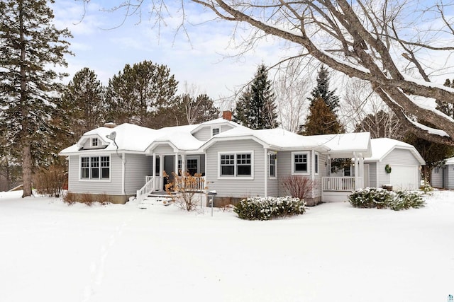 view of front of house with an outdoor structure and a garage