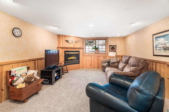 living room with carpet and a textured ceiling