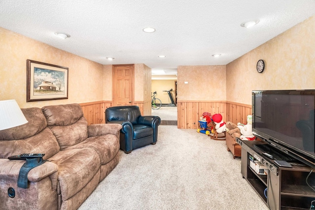 carpeted living room with a textured ceiling