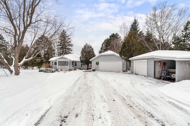 exterior space with a garage and an outdoor structure