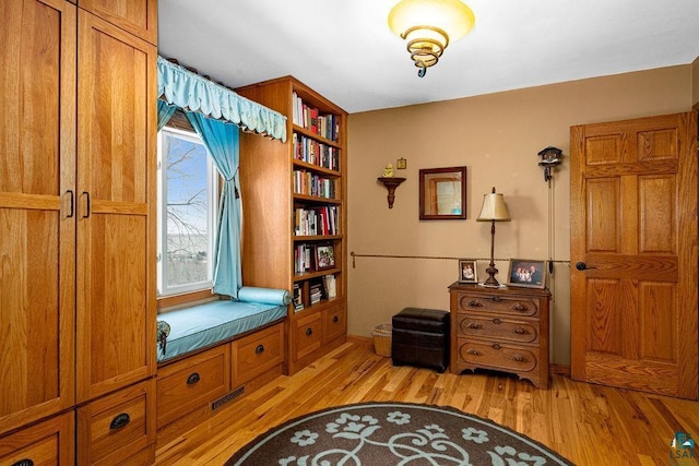 sitting room featuring light hardwood / wood-style flooring