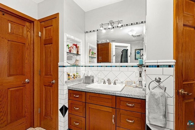 bathroom featuring tile walls and vanity