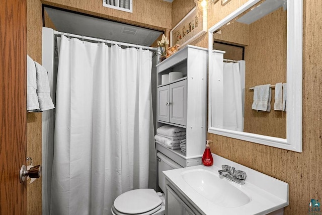 bathroom with toilet and vanity