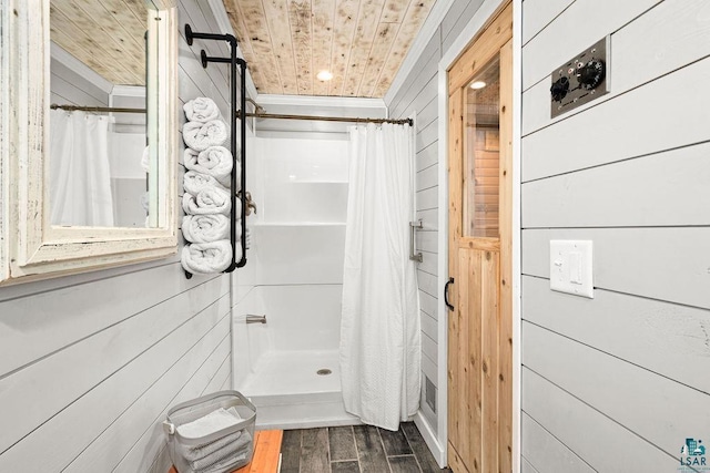 bathroom featuring a shower with curtain, wood walls, ornamental molding, and wooden ceiling