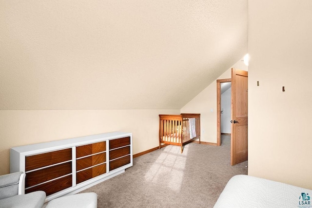 additional living space featuring vaulted ceiling and light colored carpet