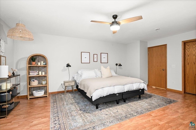 bedroom featuring ceiling fan and light wood-type flooring