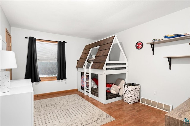 bedroom featuring hardwood / wood-style floors