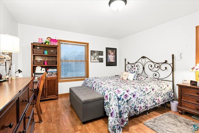 bedroom with light hardwood / wood-style flooring