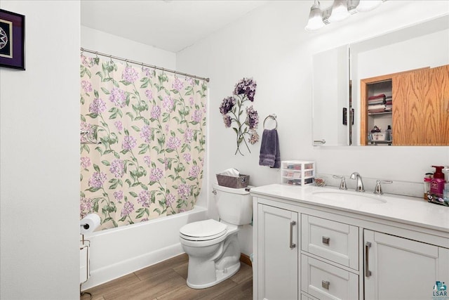 full bathroom featuring hardwood / wood-style flooring, toilet, vanity, and shower / bath combination with curtain