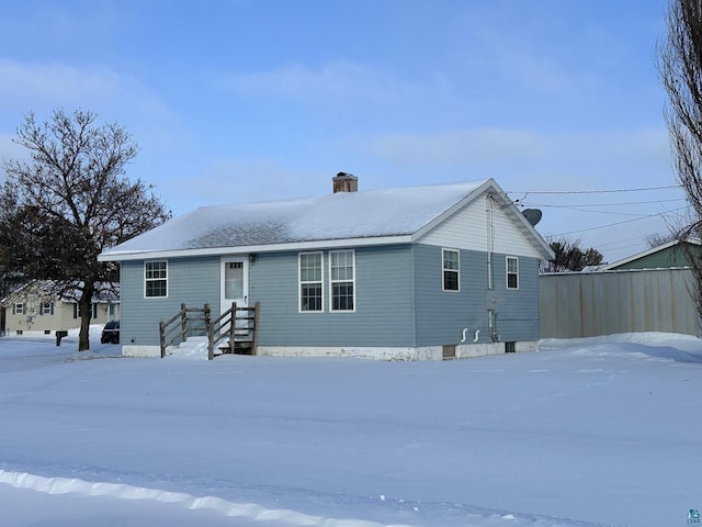 view of snow covered house