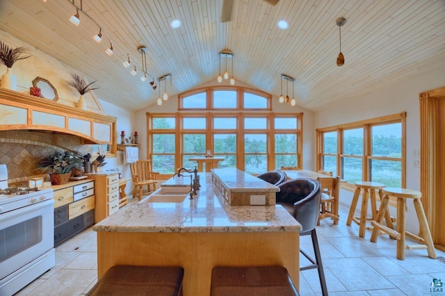 kitchen with wooden ceiling, backsplash, white gas stove, pendant lighting, and sink