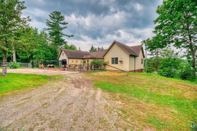 view of front of property with a patio area and a front yard