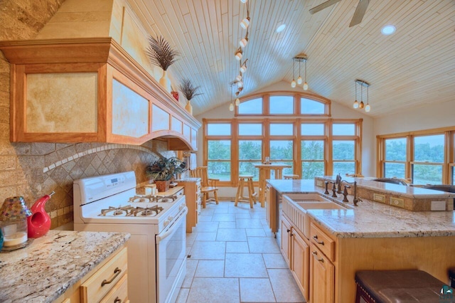 kitchen featuring gas range gas stove, wood ceiling, decorative light fixtures, decorative backsplash, and sink