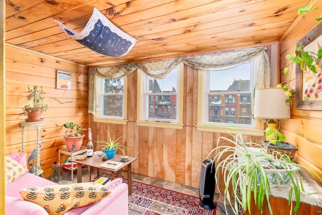 sunroom / solarium featuring wood ceiling