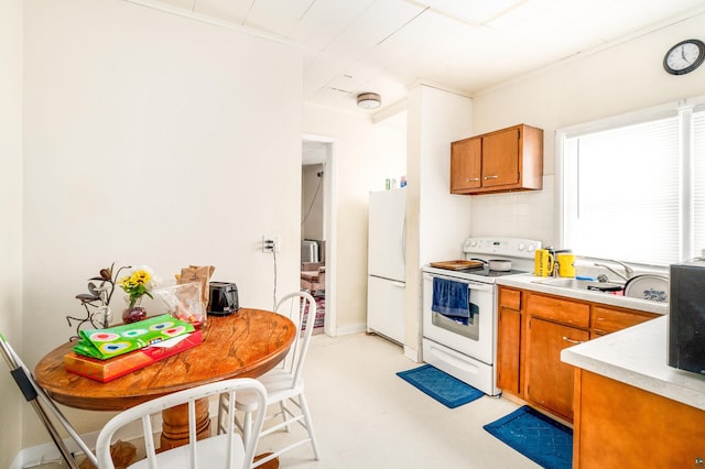 kitchen with sink and white appliances