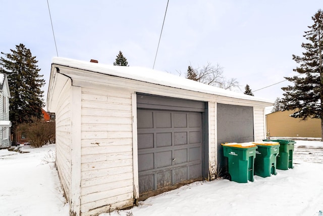 view of snow covered garage