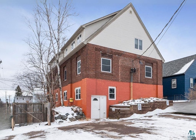 view of snow covered house