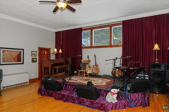7596 Werner Rd, Virginia, MN 55720 - bedroom featuring crown molding, wood-type flooring, a textured ceiling, and ceiling fan