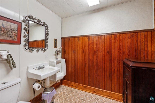 7596 Werner Rd, Virginia, MN 55720 - bathroom featuring toilet and wooden walls