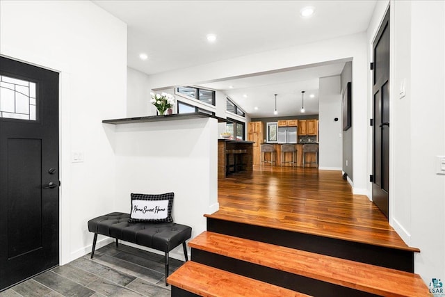 foyer entrance with a wealth of natural light