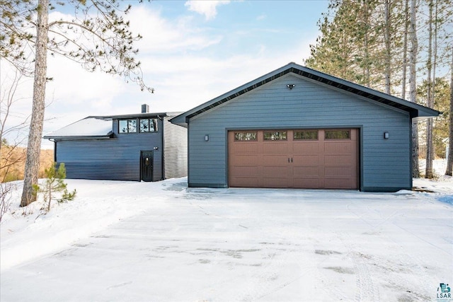 view of snow covered garage