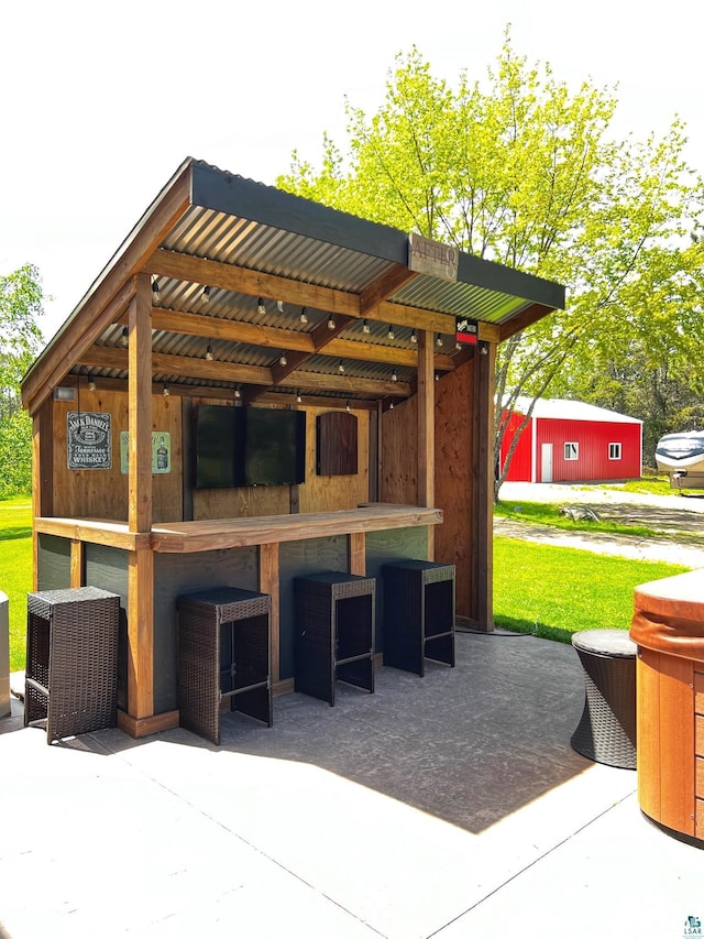 view of patio / terrace featuring an outdoor bar