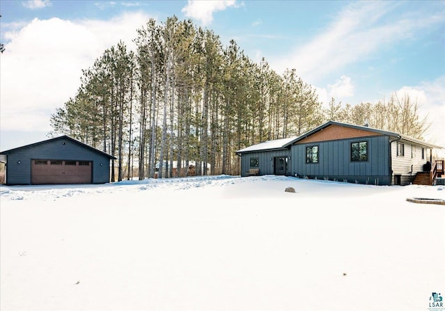 exterior space featuring an outbuilding and a garage