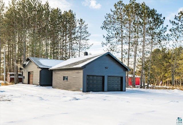 view of snow covered garage