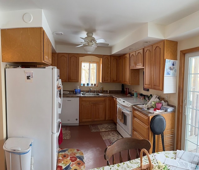 kitchen with ceiling fan, plenty of natural light, sink, and white appliances