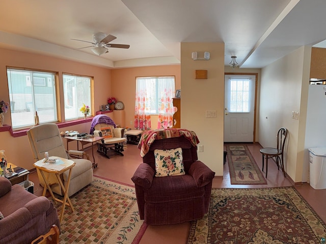 living room with ceiling fan and a wealth of natural light