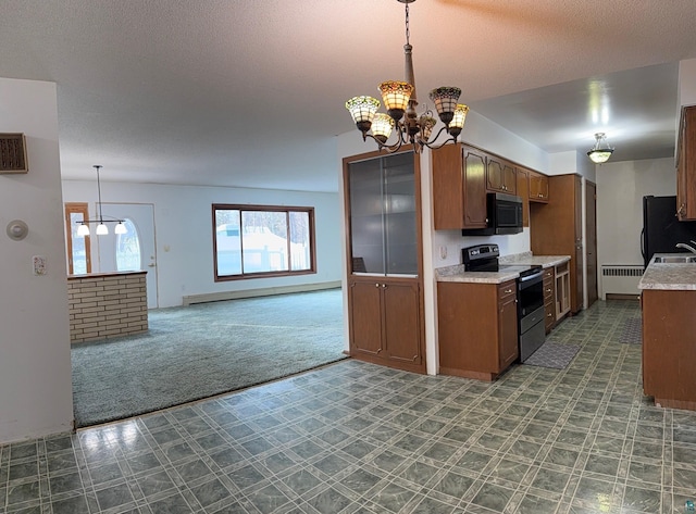 kitchen with radiator, hanging light fixtures, stainless steel appliances, dark colored carpet, and a notable chandelier