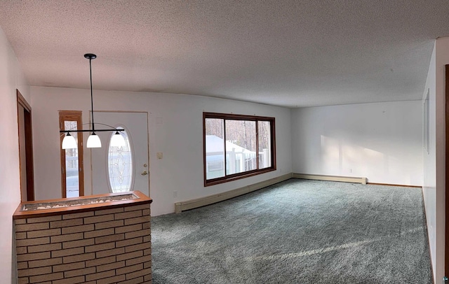 unfurnished living room featuring a textured ceiling and carpet flooring