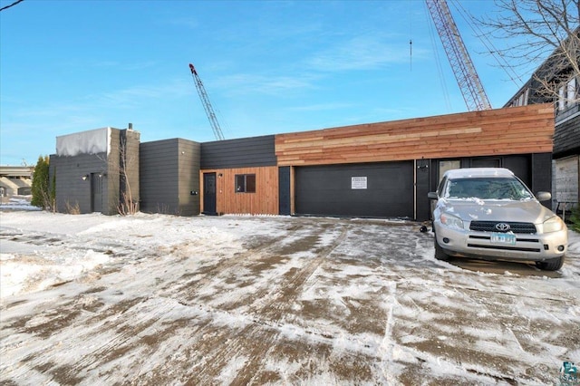 view of snow covered garage