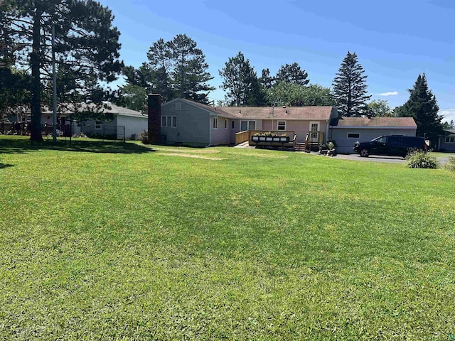 view of yard with a wooden deck