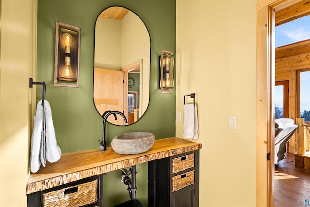 bathroom featuring vanity and wood-type flooring