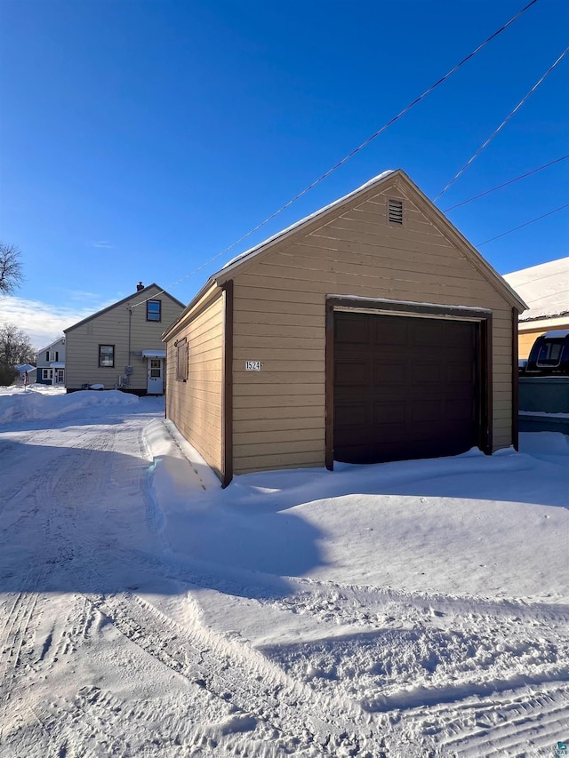 view of snow covered garage