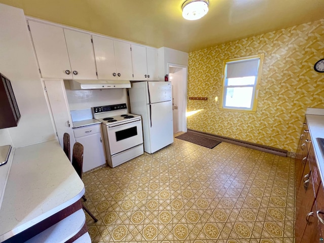 kitchen with white appliances and white cabinets