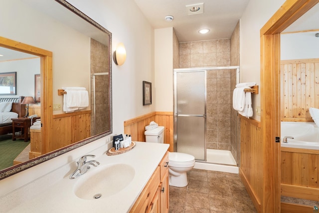 full bathroom with vanity, wooden walls, independent shower and bath, and toilet