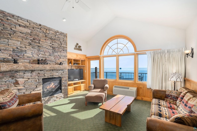 living room featuring built in shelves, lofted ceiling, wood walls, a wall mounted AC, and dark carpet