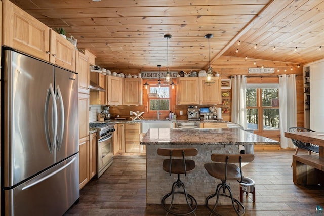 kitchen featuring stainless steel appliances, a center island, light stone counters, decorative light fixtures, and wooden ceiling