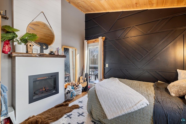 bedroom featuring lofted ceiling and wooden ceiling