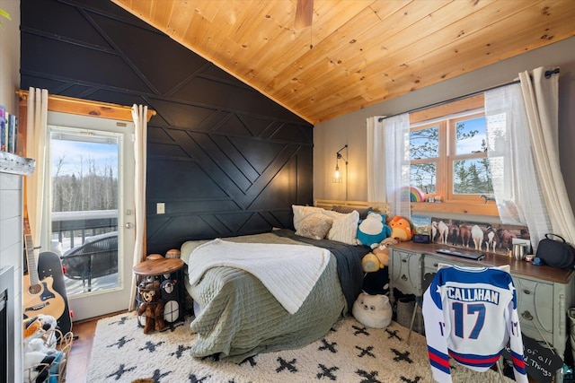 bedroom featuring multiple windows, wood ceiling, and vaulted ceiling