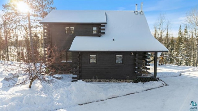 view of snow covered property