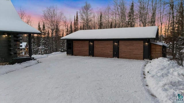 view of snow covered garage