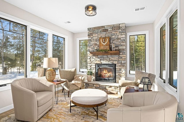 sunroom with a fireplace