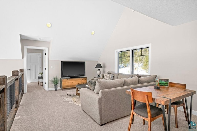 living room featuring light carpet and high vaulted ceiling